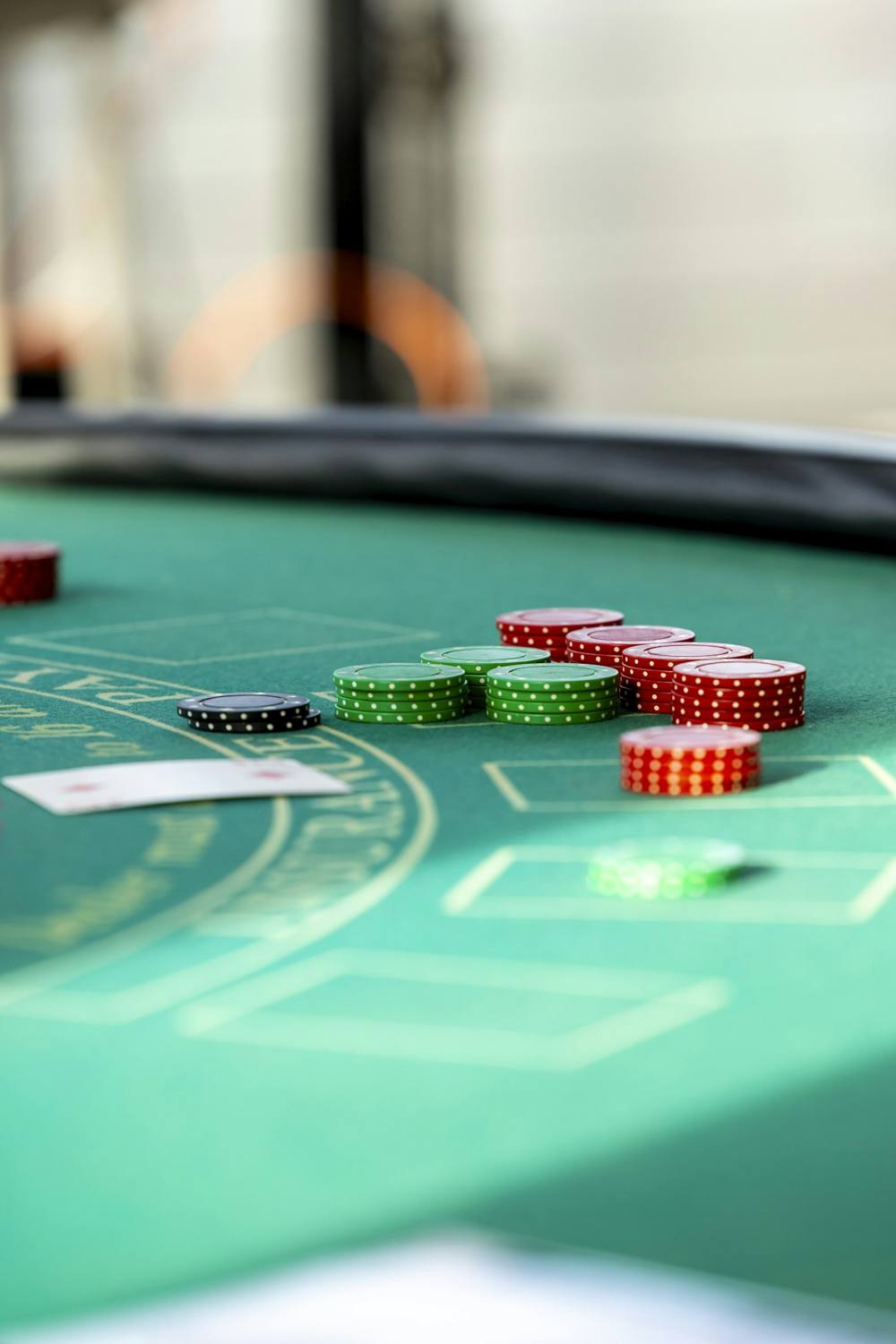 Red and green chips on a green gaming table