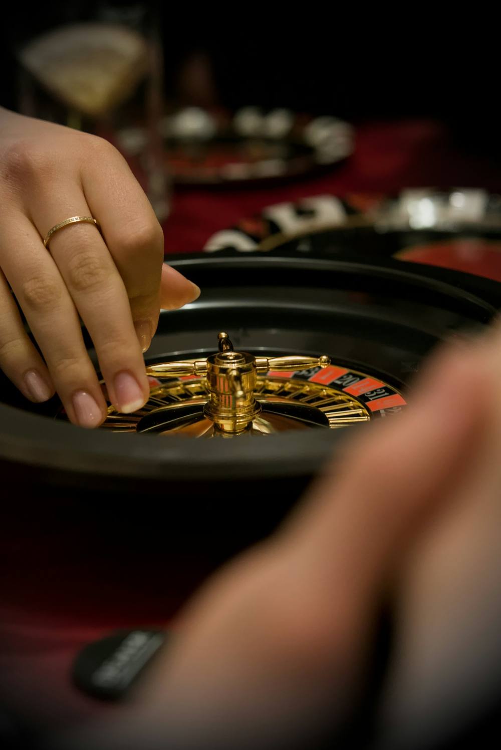Hand placing chips at a roulette table