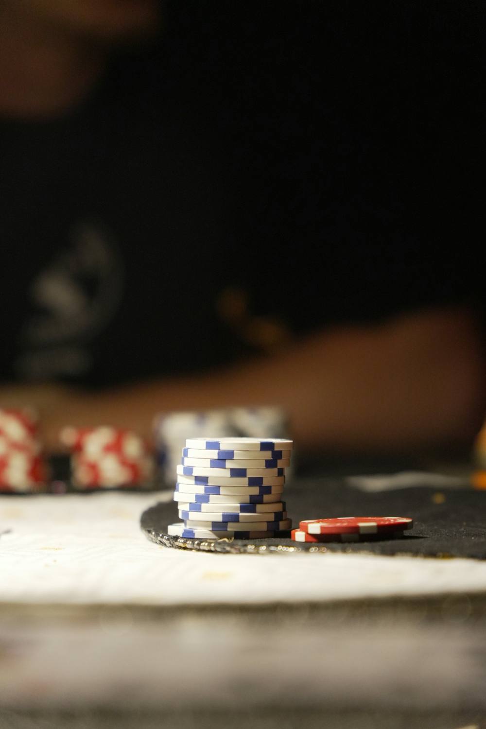 Stack of blue and white chips on a table