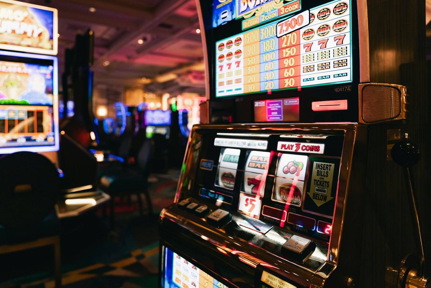 Slot machines in a dim hall